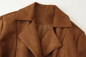 Detailed close-up of a brown faux suede coat collar with refined texture and clean stitching