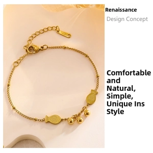 Detail of gold fish pendant bracelet with round beads and adjustable lobster clasp