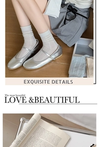 Close-up of thin white slouch socks paired with silver Mary Jane shoes on wood floor