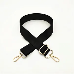Adjustable black nylon shoulder strap with gold metal hooks and buckle for bags