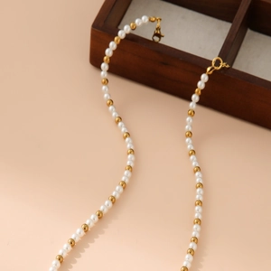 Elegant necklace with white glass pearls and gold stainless steel beads for women