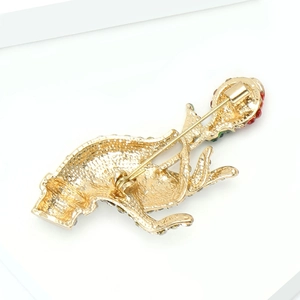 Detail view of the secure pin clasp on the back of this golden mythical animal brooch