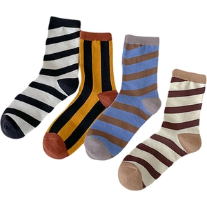 Pack of four striped cotton crew socks in various colorful patterns on white background