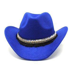 Detail of royal blue western cowboy hat featuring ethnic braided band and black tassels