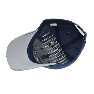 Detailed view of the 100% cotton inner lining and adjustable metal buckle on blue cap