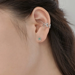 Close-up of S925 silver mushroom stud earring and crystal vine ear cuff on ear