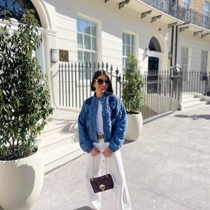Ethnic vintage blue quilted embroidered jacket styled with white trousers and black bag