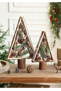 Detail of wooden Christmas tree decor with natural pine cones and festive red berries