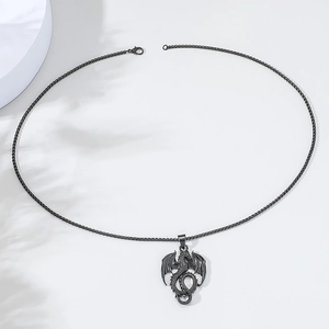 Detail of vintage black metal dragon pendant necklace with matching punk chain link
