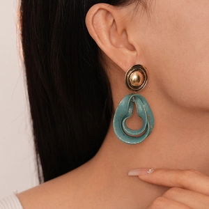 Vintage geometric drop earrings with gold studs and teal splatter resin rings