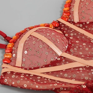 Detail of red mesh bodice with luxury hand-beaded orange gems and silver sequins