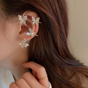 Sparkling silver butterfly ear cuff with rhinestones for non-pierced ears on a model