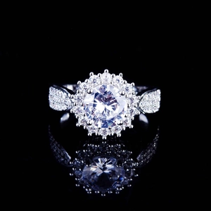 Luxury silver bridal ring with large round zircon center stone and halo pave setting