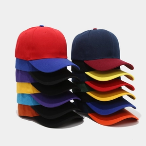 Stack of multi-color patchwork baseball caps showing various high-contrast color combinations