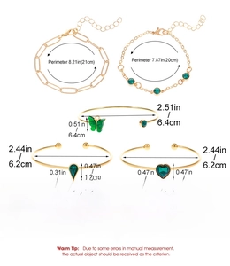 Detailed size chart for five-piece gold bracelet set with green gemstones and charms