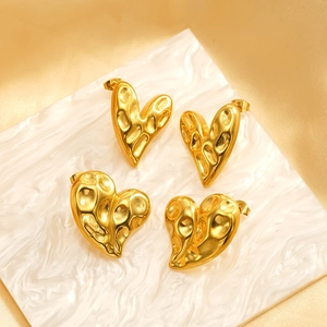 Golden heart-shaped stainless steel earrings with irregular liquid metal texture design