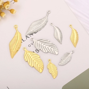 Polished stainless steel leaf and feather pendants in gold and silver finish