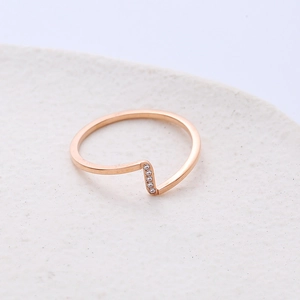 Elegant rose gold wave ring featuring micro-set white cubic zirconia with an open design