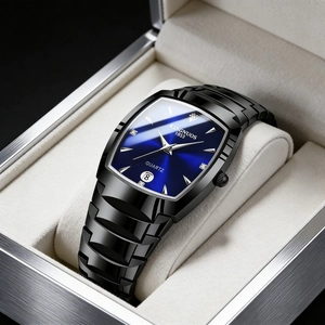 Detailed macro view of a square blue dial quartz watch with calendar window on cushion