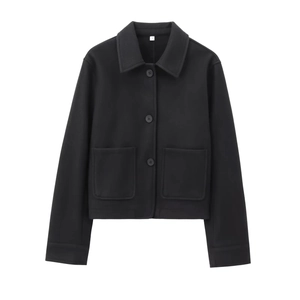 Detailed view of black cropped button-up jacket with front pockets in soft wool-like fabric