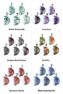 Macro view of six natural carved moon face pendants including Amethyst and Unakite