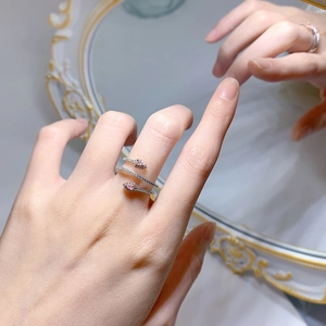 Elegant 925 silver snake-shaped ring with sparkling pink crystals on a model hand