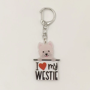 Detail showing Westie acrylic keychain with silver metal ring and I love my Westie text