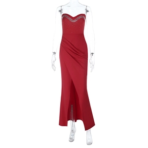 Detail of silver rhinestones on red strapless satin dress with high side slit