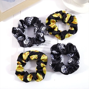 Set of four satin sports scrunchies featuring volleyball and softball patterns on cards