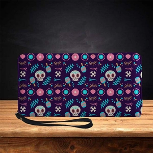 Long purple zip leather wallet with Mexican skull and floral print on wood surface