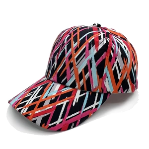 Detailed close-up of colorful abstract graffiti patterns on canvas baseball cap