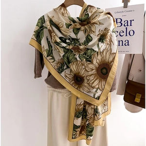 Fashionable silk scarf with vibrant sunflower print and yellow borders for autumn outfits