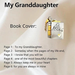 Macro view of book-shaped titanium steel pendant with engraved love poem for granddaughter