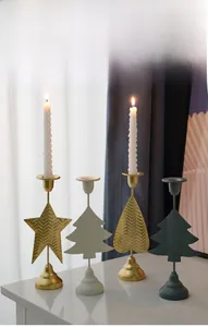 Close-up of assorted heart and star shaped metal candle holders for home decor