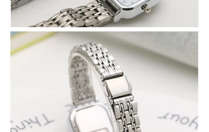 Detail view of square stainless steel watch with multi-link strap and folding clasp