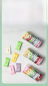 Detail of 14-count travel compressed towels in colorful candy packaging inside a clear box