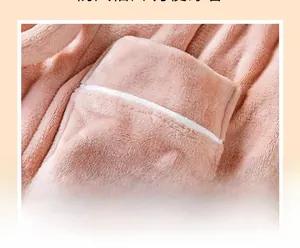 Close-up of pink flannel bathrobe with white stitched pocket detailing and soft texture