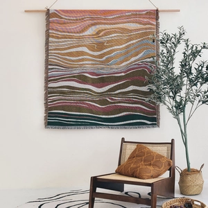 Bohemian woven cotton throw blanket with abstract mountain landscape and fringe trim