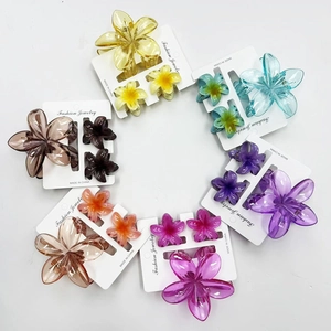 Frangipani plumeria hair claw clips set in various colors with translucent resin finish