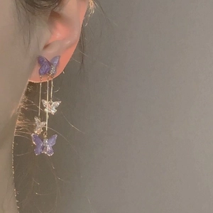 Elegant purple butterfly tassel drop earrings with shimmering glitter finish and long chain
