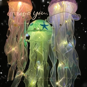 DIY handmade hanging jellyfish lamp set with shells and starfish in pink, green, and purple
