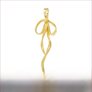Detailed view of gold ribbon bow pendant with dimensions 20mm by 47.5mm on brass jewelry