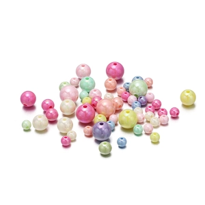 Macro shot of colorful acrylic mixed beads in various sizes for DIY jewelry crafts