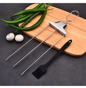 Three-prong stainless steel BBQ skewers with a slider and a black silicone oil brush