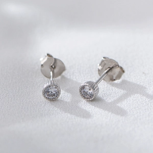 Minimalist S925 sterling silver stud earrings featuring round cubic zirconia in a bezel setting