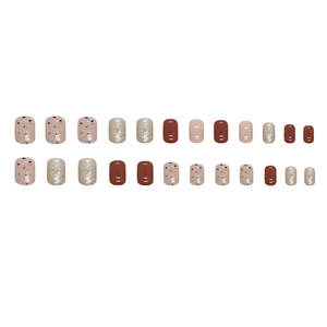 Short square press-on nails set in caramel brown and sparkling champagne glitter