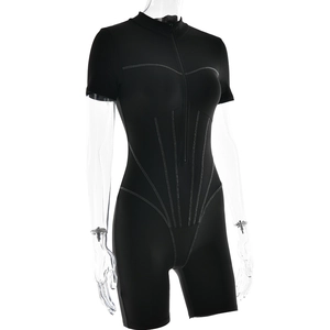 Detail of black short sleeve bodysuit with white contrast stitching and front zipper