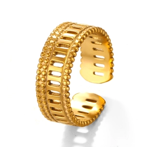 Adjustable golden stainless steel ring with double-beaded borders and hollow geometric patterns