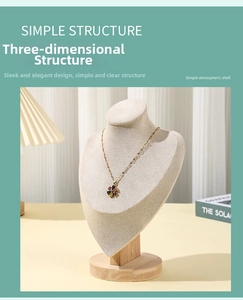 Detail of flower pendant necklace with colorful gems on a beige mannequin stand
