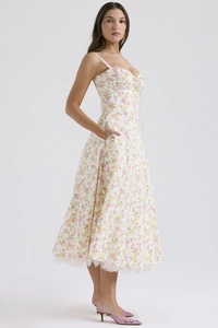 Detailed close-up of French floral summer dress with lace hem and delicate tie-up chest design
